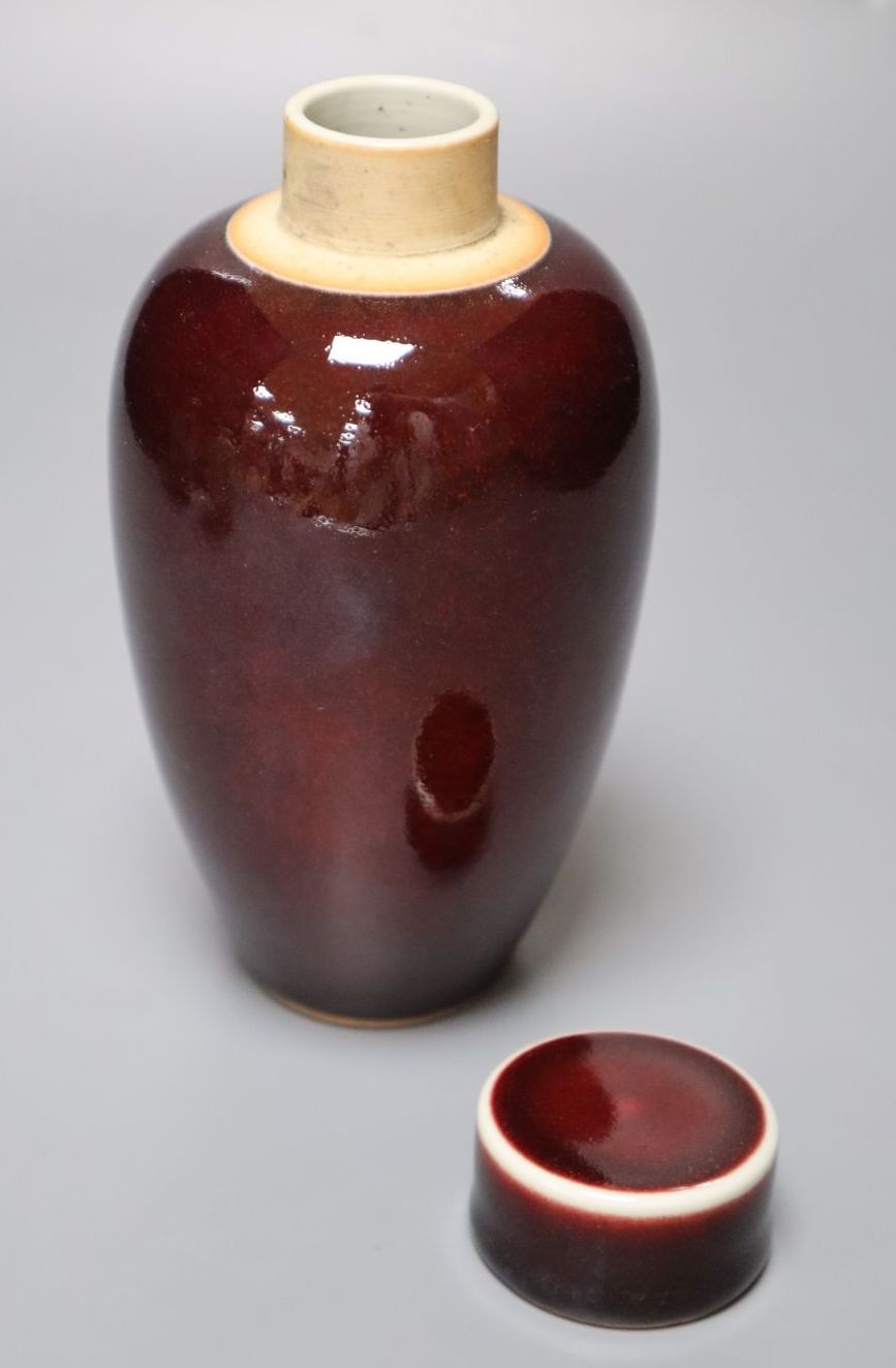A Chinese deep red glazed jar and cover, 16cm, and two Satsuma vases